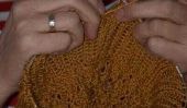 Tricotage modèle pour un pull avec capuche