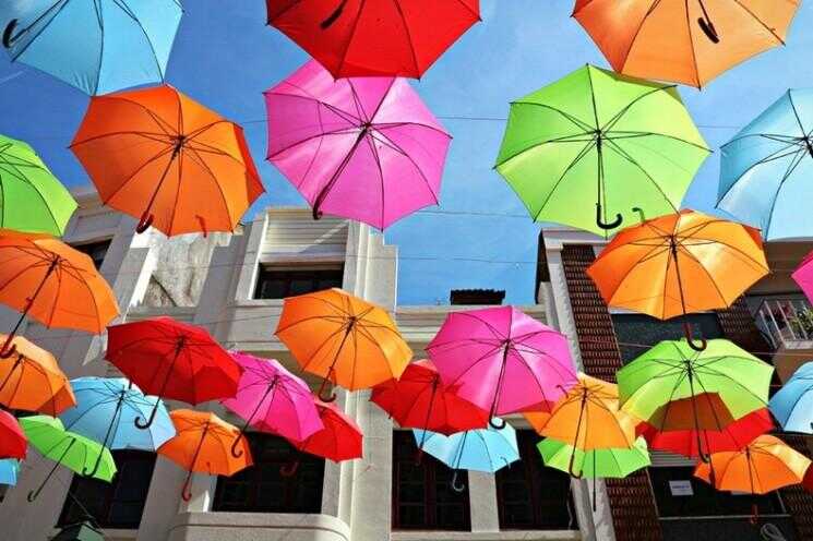 Colorful Umbrella Installation Floating à Agueda, Portugal