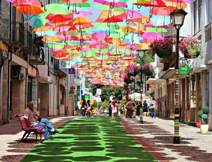 Colorful Umbrella Installation Floating à Agueda, Portugal
